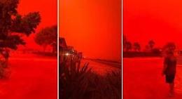 Cielo apocalittico in Australia, il ciclone Narelle tinge tutto rosso sangue: le immagini diventano virali